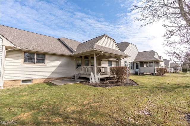 847 Beverly Ave, Canal Fulton, OH 44614 - back of property with a yard and roof with shingles