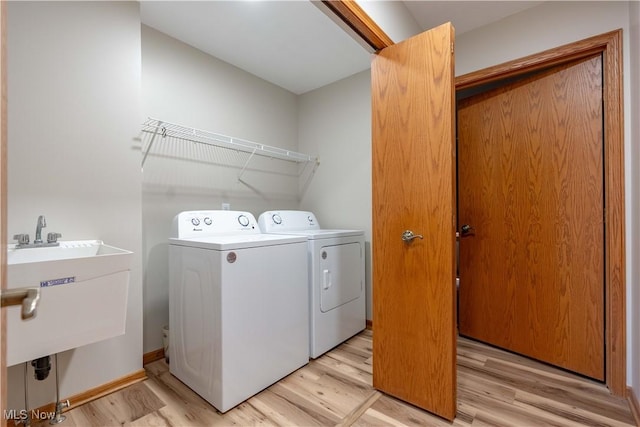 847 Beverly Ave, Canal Fulton, OH 44614 - laundry area featuring washer and dryer, light wood-style floors, and baseboards