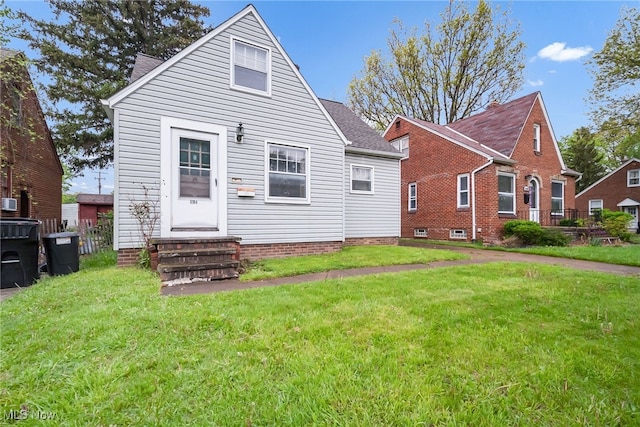 4194 W 140th St, Cleveland, OH 44135 - rear view of property featuring entry steps, a lawn, and roof with shingles
