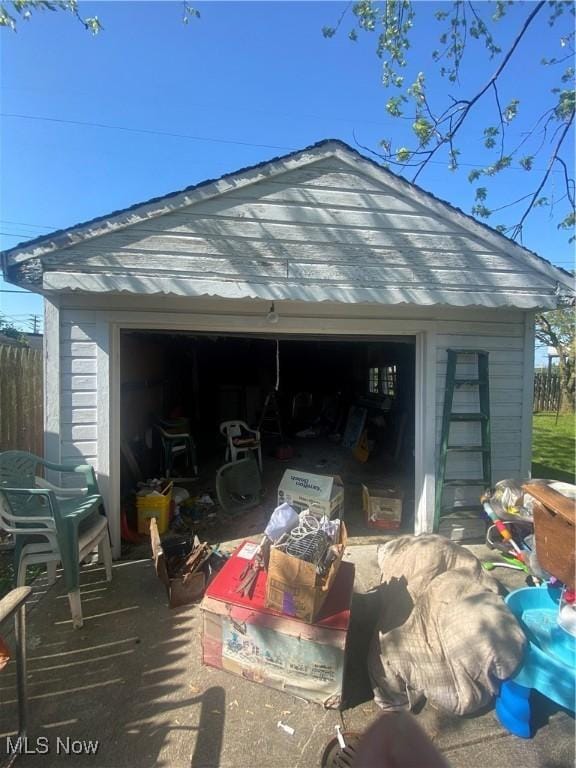 garage with fence