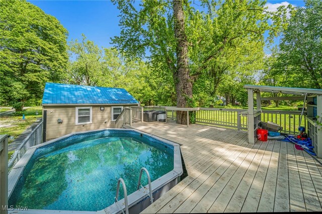 6329 Green Rd, North Kingsville, OH 44004 - view of pool with a deck, view of wooded area, and an outdoor structure
