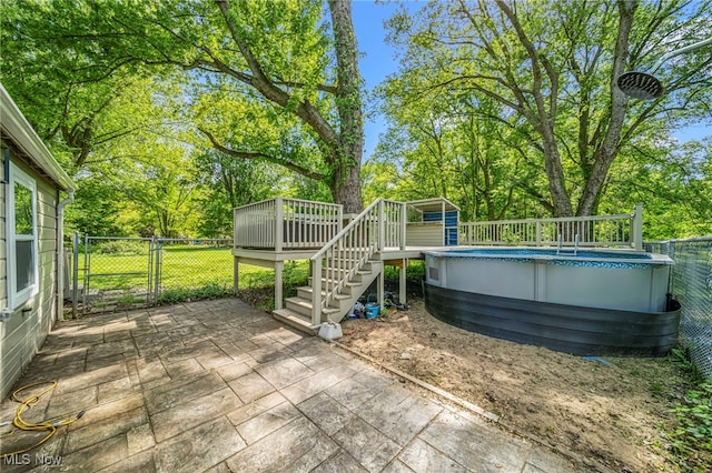 6329 Green Rd, North Kingsville, OH 44004 - exterior space featuring a deck, an outdoor pool, stairs, and view of scattered trees