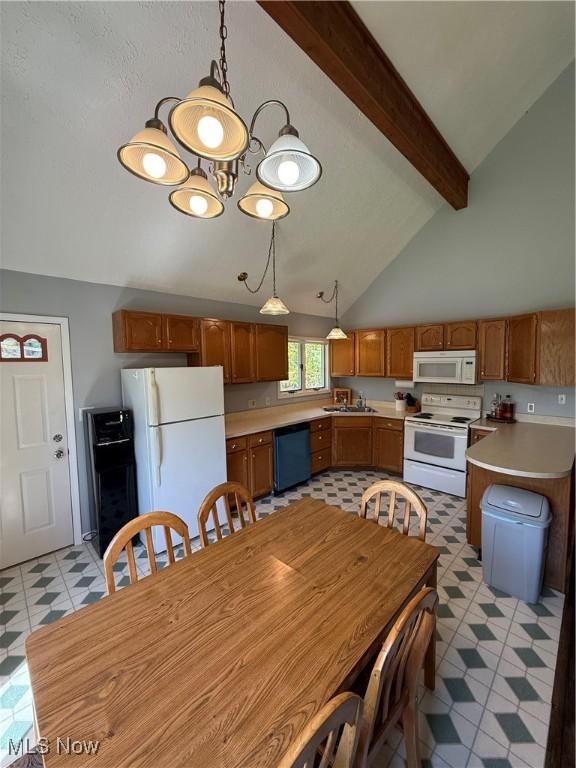 5123 Hemlock Ln, Harpersfield, OH 44041 - dining space with light flooring, beam ceiling, and high vaulted ceiling