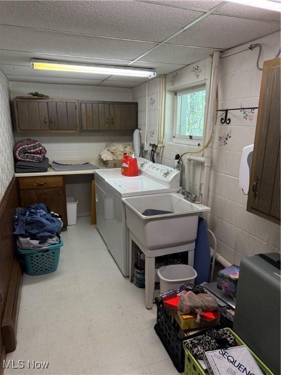 5123 Hemlock Ln, Harpersfield, OH 44041 - washroom featuring washer and dryer, cabinet space, light floors, and concrete block wall
