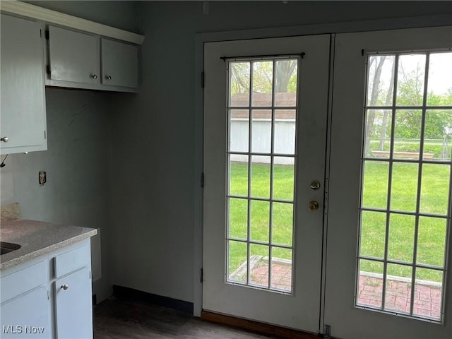 doorway featuring dark wood-style flooring