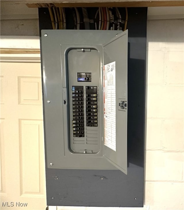 utility room featuring electric panel
