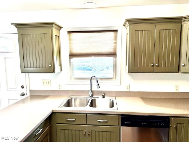 102 Maple, Bethesda, OH 43719 - kitchen featuring dishwasher, a sink, and light countertops