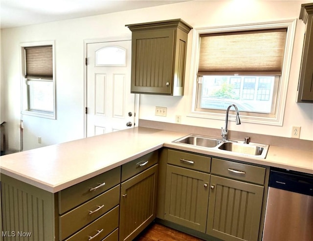 102 Maple, Bethesda, OH 43719 - kitchen featuring stainless steel dishwasher, a sink, a peninsula, and light countertops