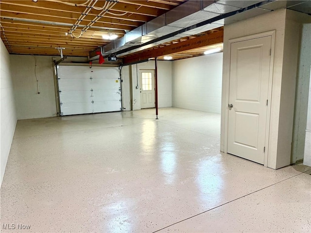 102 Maple, Bethesda, OH 43719 - garage with a garage door opener and concrete block wall
