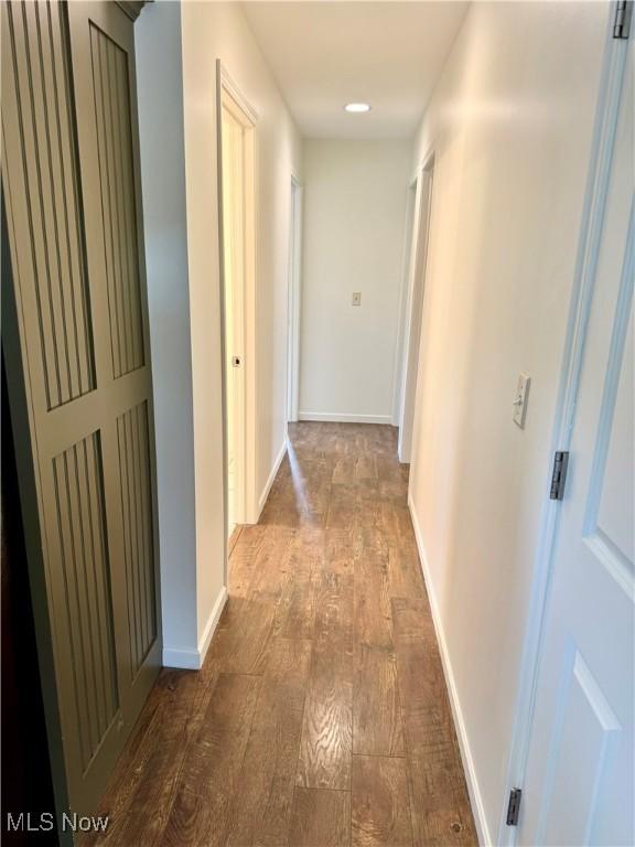 102 Maple, Bethesda, OH 43719 - hallway with dark wood finished floors and baseboards