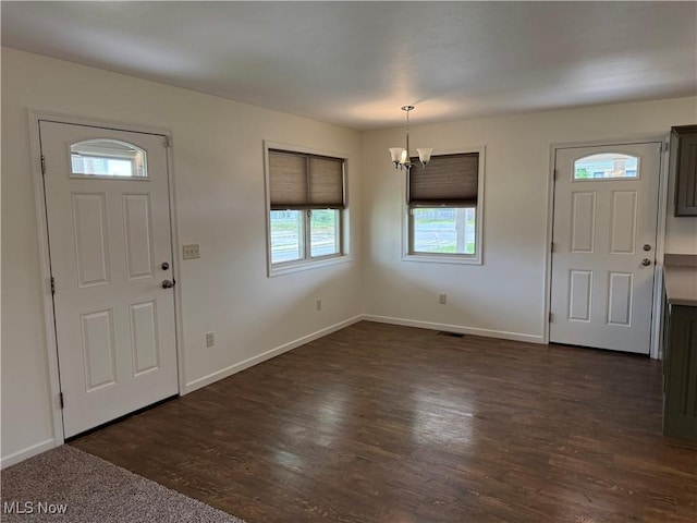 102 Maple, Bethesda, OH 43719 - entrance foyer with a chandelier, baseboards, and dark wood-style flooring