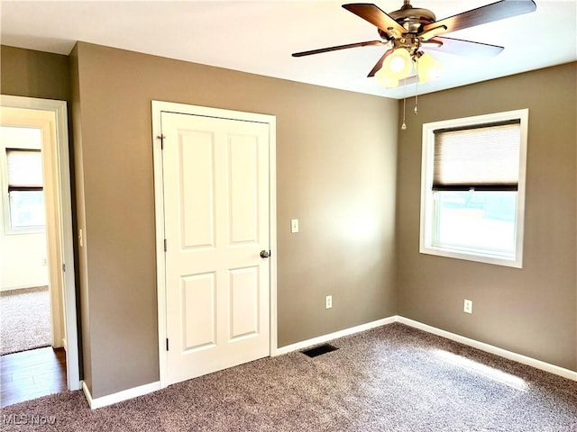 102 Maple, Bethesda, OH 43719 - unfurnished bedroom with carpet, baseboards, and ceiling fan