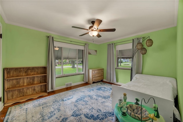 3475 Clague Rd, North Olmsted, OH 44070 - bedroom featuring ornamental molding, wood finished floors, ceiling fan, and baseboards