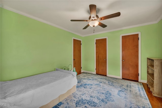3475 Clague Rd, North Olmsted, OH 44070 - bedroom featuring crown molding, baseboards, a ceiling fan, and wood finished floors