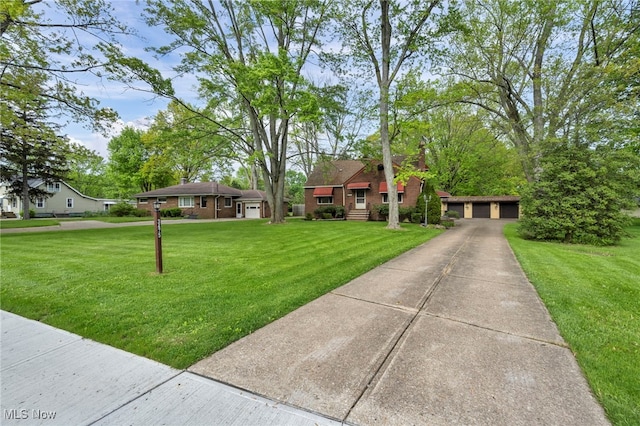 3475 Clague Rd, North Olmsted, OH 44070 - view of front of home with a front lawn and a detached garage