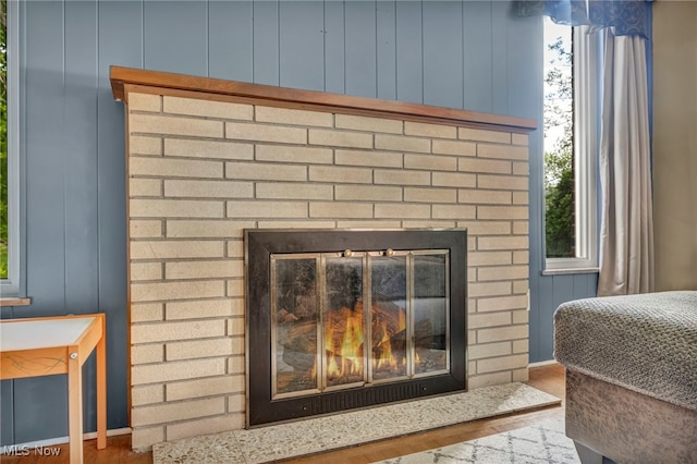 3475 Clague Rd, North Olmsted, OH 44070 - detailed view of a fireplace, wood finished floors, and baseboards