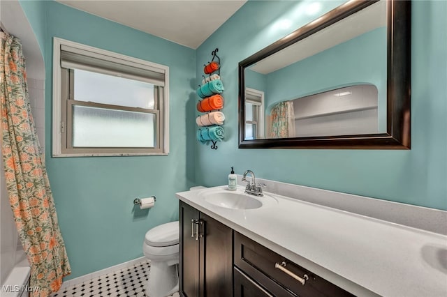 3475 Clague Rd, North Olmsted, OH 44070 - full bathroom with toilet, vanity, and baseboards