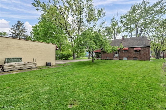 3475 Clague Rd, North Olmsted, OH 44070 - view of grassy yard with entry steps