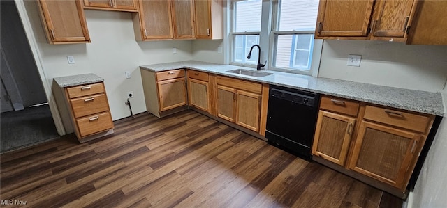 kitchen featuring dishwasher, a sink, dark wood finished floors, and light stone countertops