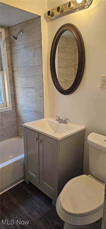 3608 E 154th St, Cleveland, OH 44120 - full bath with toilet, vanity, bathtub / shower combination, and wood finished floors