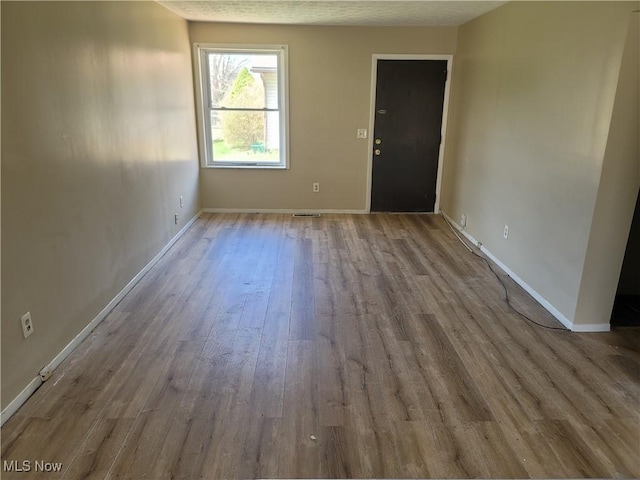 681 Longcoy Ave, Kent, OH 44240 - unfurnished room featuring wood finished floors and baseboards
