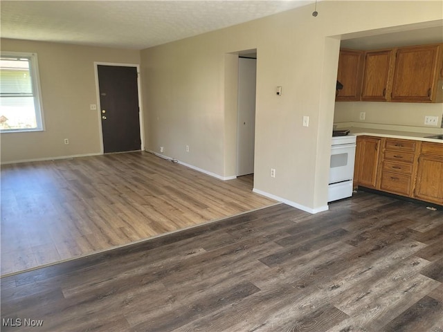 681 Longcoy Ave, Kent, OH 44240 - unfurnished living room with dark wood-type flooring and baseboards