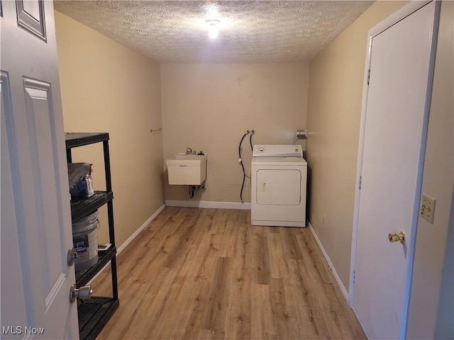 681 Longcoy Ave, Kent, OH 44240 - laundry room with washer / dryer, light wood finished floors, a textured ceiling, and baseboards