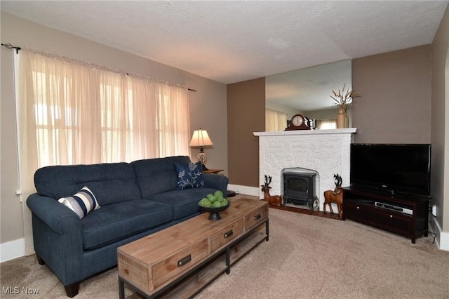 1255 Gorge Blvd, Akron, OH 44310 - carpeted living area with baseboards and a fireplace with flush hearth