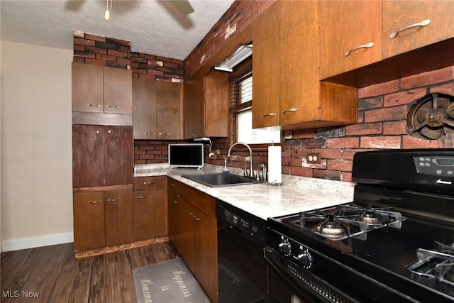 1255 Gorge Blvd, Akron, OH 44310 - kitchen featuring black appliances, a sink, light countertops, dark wood finished floors, and a textured ceiling
