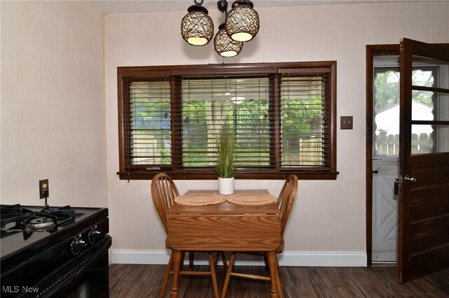 1255 Gorge Blvd, Akron, OH 44310 - dining area featuring baseboards, dark wood-style flooring, and a chandelier
