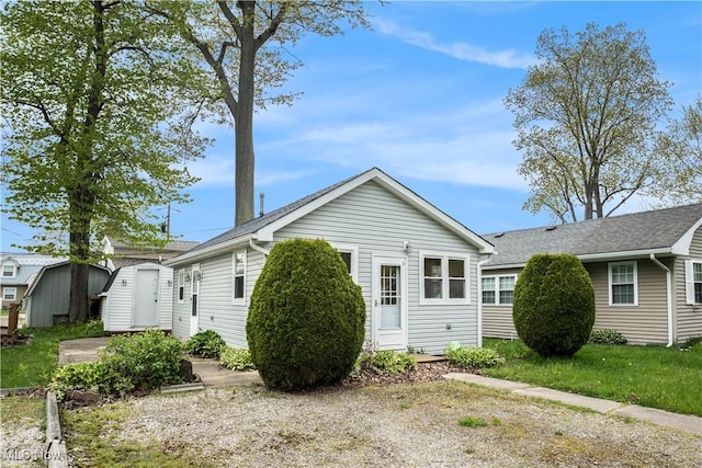 5755 Lake Rd W Unit 6, Ashtabula, OH 44004 - view of side of home featuring a storage unit, an outbuilding, and roof with shingles