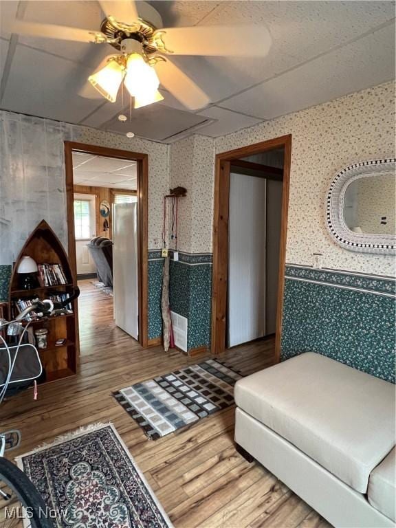 5755 Lake Rd W Unit 6, Ashtabula, OH 44004 - living room with wallpapered walls, a ceiling fan, and wood finished floors