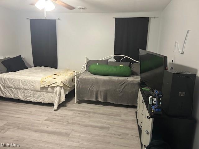 4718 Brushwood Rd, Wakeman, OH 44889 - bedroom with light wood-type flooring and a ceiling fan
