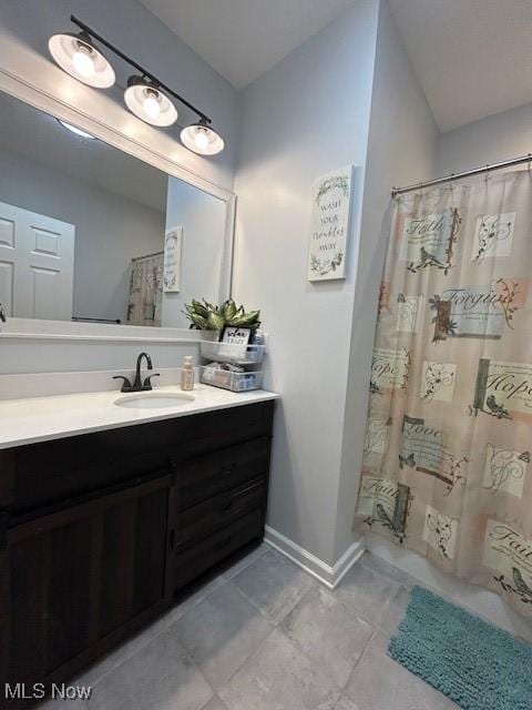 4718 Brushwood Rd, Wakeman, OH 44889 - full bathroom with vanity, tile patterned flooring, baseboards, and shower / bathtub combination with curtain