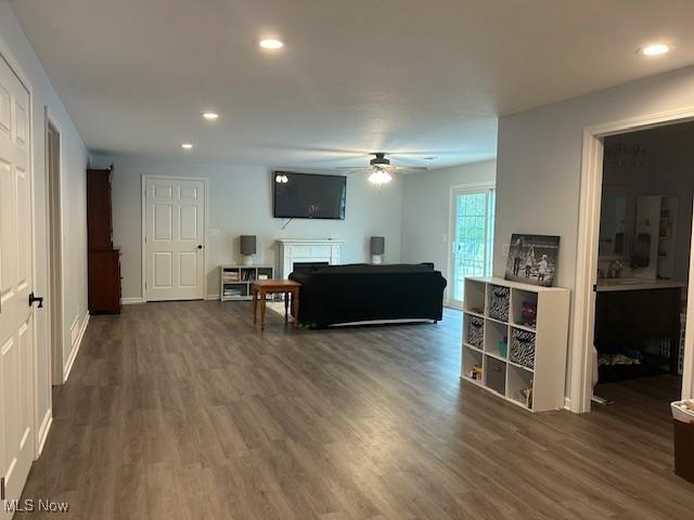 4718 Brushwood Rd, Wakeman, OH 44889 - living area featuring a ceiling fan, wood finished floors, a fireplace, recessed lighting, and baseboards