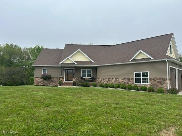 4718 Brushwood Rd, Wakeman, OH 44889 - view of front of property featuring stone siding and a front yard