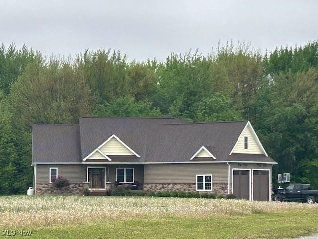 4718 Brushwood Rd, Wakeman, OH 44889 - view of front of property featuring a forest view and a front yard