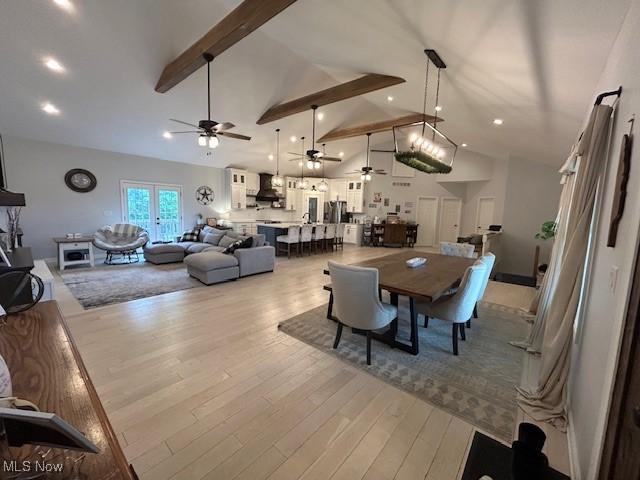 4718 Brushwood Rd, Wakeman, OH 44889 - dining area with ceiling fan, beamed ceiling, high vaulted ceiling, and light wood-style floors