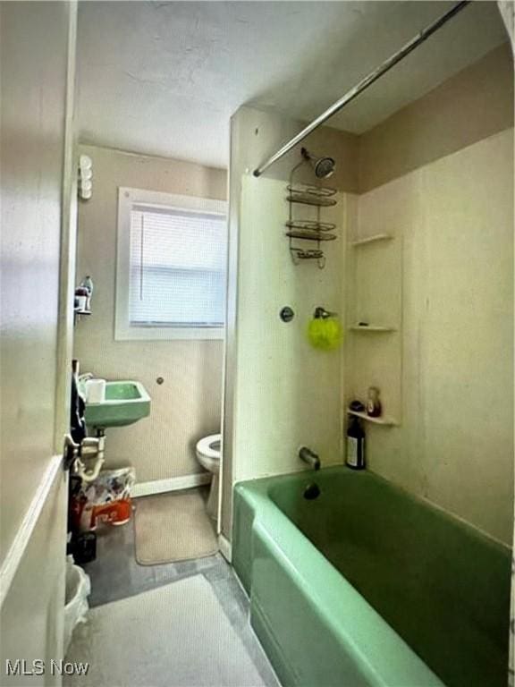 438 Elberen St, Youngstown, OH 44509 - full bathroom with toilet, concrete floors, washtub / shower combination, and a sink