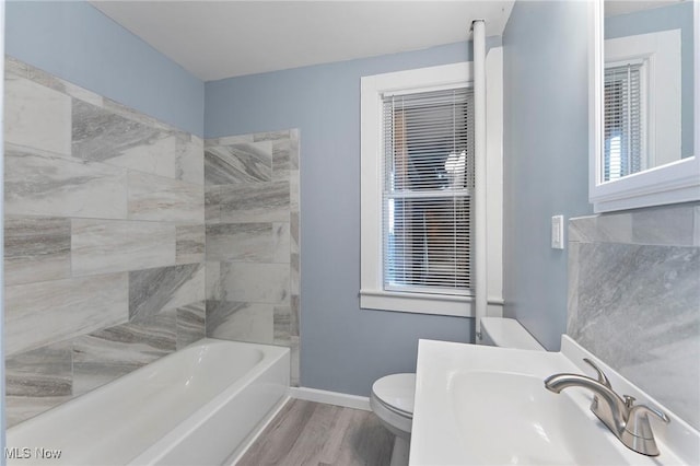 215 Holford Ave, Niles, OH 44446 - bathroom featuring a sink, toilet, wood finished floors, and baseboards