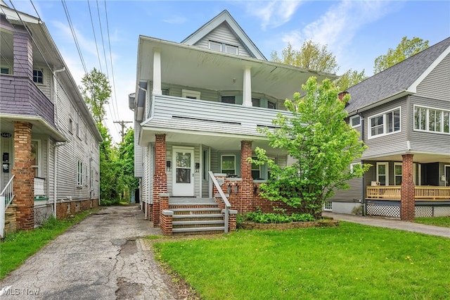 3436 Beechwood Ave, Cleveland Heights, OH 44118 - multi unit property featuring a balcony, a front lawn, covered porch, and driveway