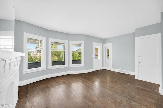 3436 Beechwood Ave, Cleveland Heights, OH 44118 - unfurnished living room with baseboards, plenty of natural light, and hardwood / wood-style flooring