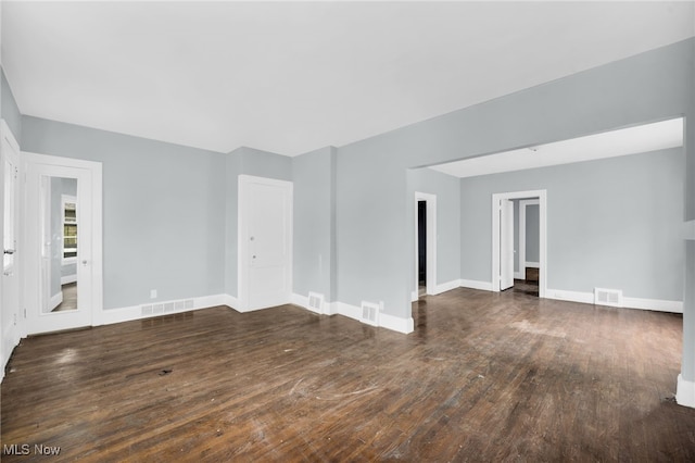 3436 Beechwood Ave, Cleveland Heights, OH 44118 - unfurnished living room with hardwood / wood-style floors and baseboards