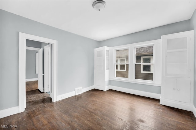 3436 Beechwood Ave, Cleveland Heights, OH 44118 - empty room with dark wood-style flooring and baseboards