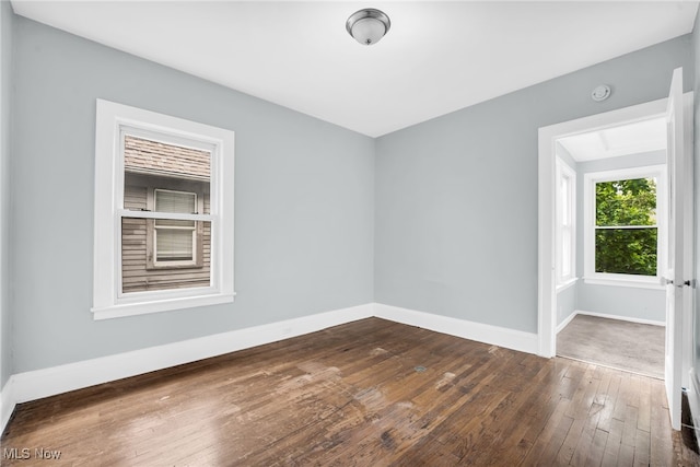 3436 Beechwood Ave, Cleveland Heights, OH 44118 - spare room featuring dark wood-style flooring, baseboards, and a smoke detector
