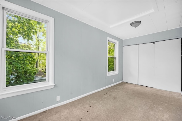 3436 Beechwood Ave, Cleveland Heights, OH 44118 - unfurnished bedroom featuring carpet, a closet, and baseboards