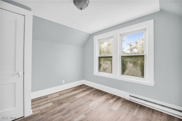 3436 Beechwood Ave, Cleveland Heights, OH 44118 - bonus room with lofted ceiling, wood finished floors, baseboards, and a baseboard heating unit