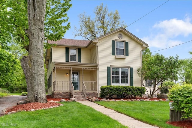 315 W Main St, Canfield, OH 44406 - traditional home with a porch and a front lawn