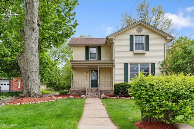 315 W Main St, Canfield, OH 44406 - view of front of property featuring covered porch and a front yard