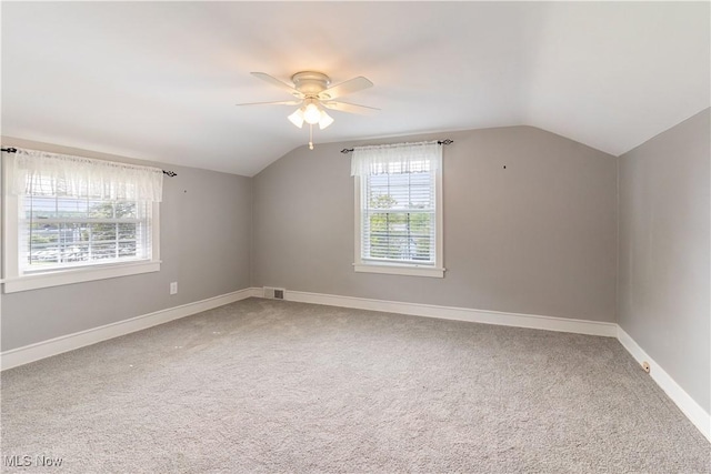 315 W Main St, Canfield, OH 44406 - additional living space featuring lofted ceiling, a ceiling fan, baseboards, and carpet flooring